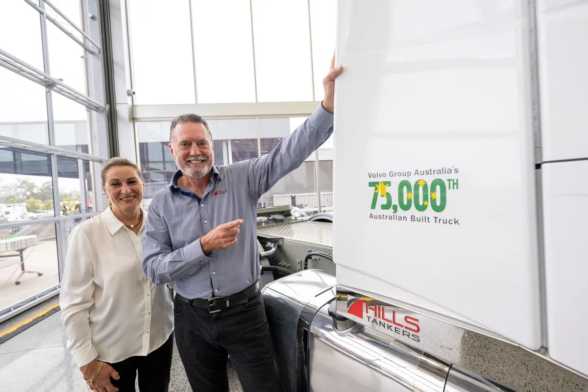 Andrew and Vicki Hill beside Volvo Group Australia's 75,000th Australian-built truck, in Hills Tankers livery