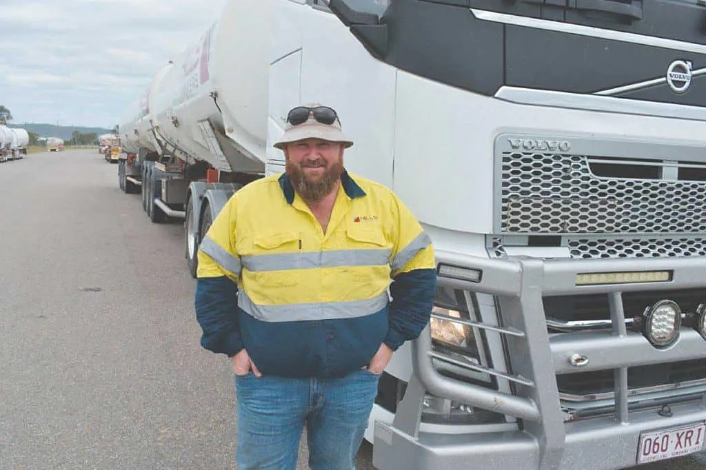 Hills Tankers driver Scott Hawker in front of his Volvo tanker