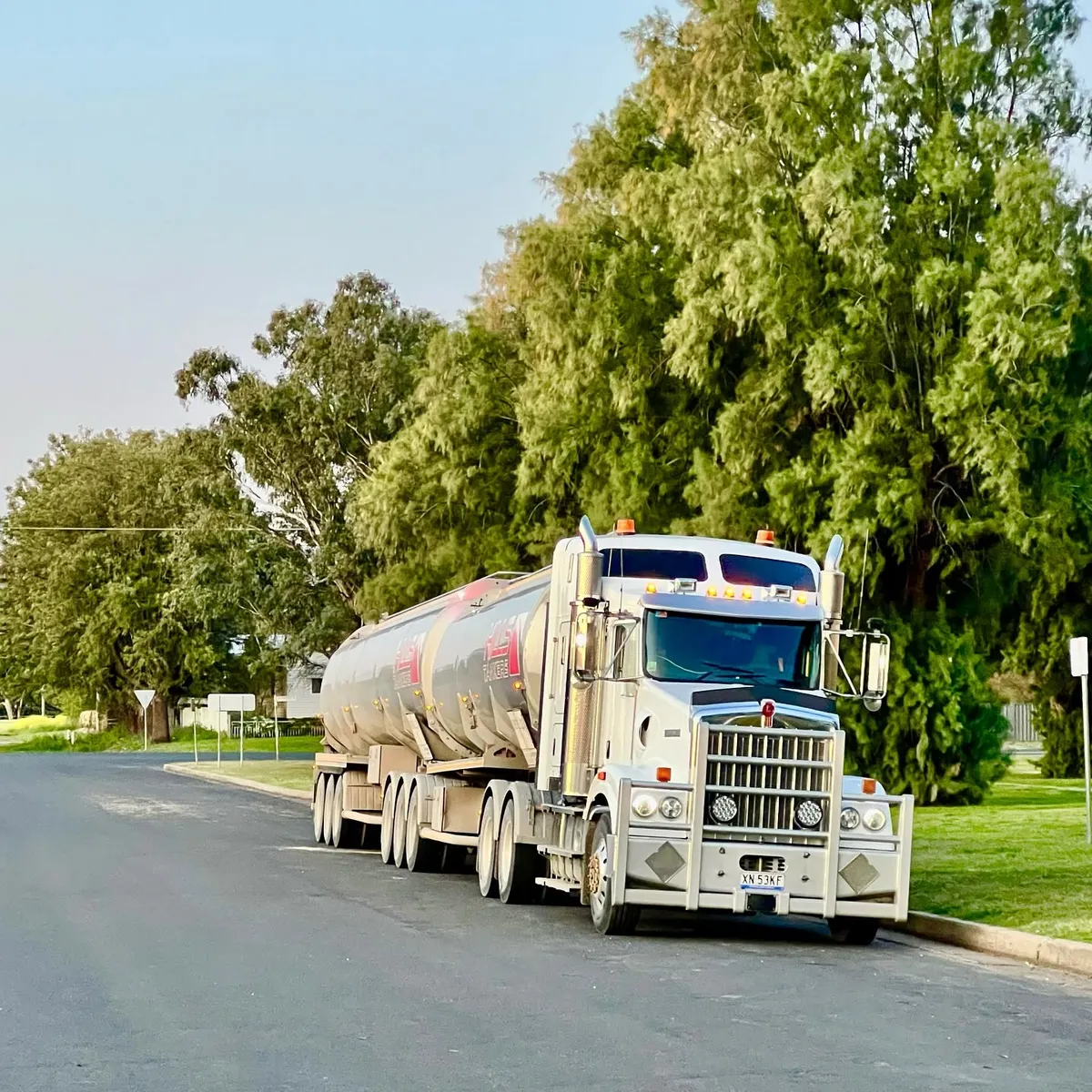 Hills Tankers Kenworth road train pulled up at dusk between runs
