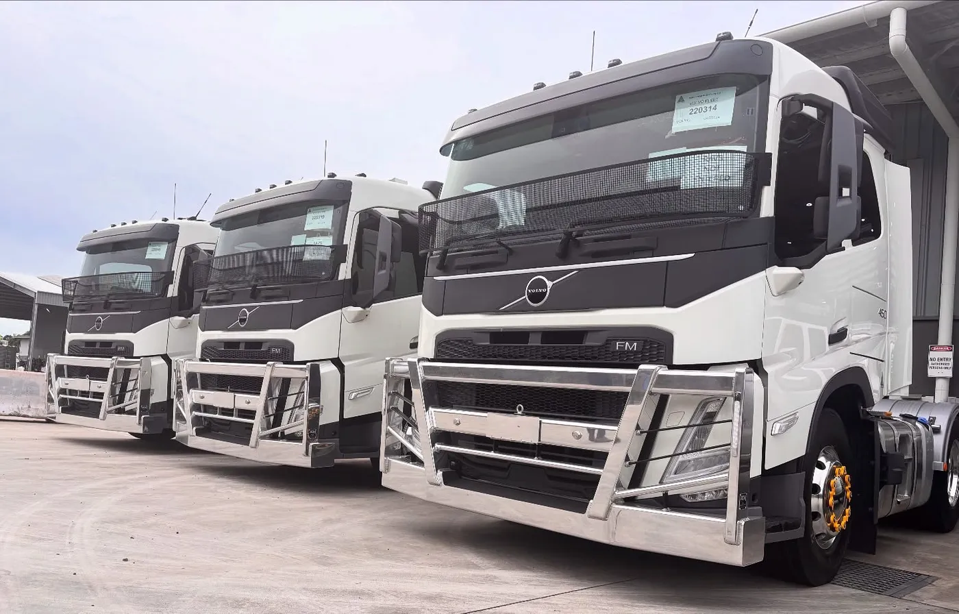 Three brand-new white Volvo prime movers with polished alloy bullbars lined up at the Hills Tankers Beresfield head office