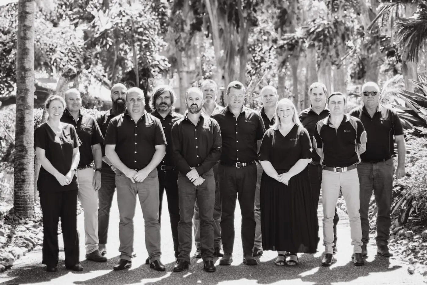 The Hills Tankers team in a black and white group portrait