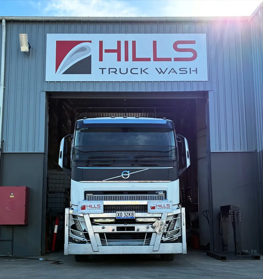 Volvo prime mover under the Hills Truck Wash signage at the Beresfield wash bay